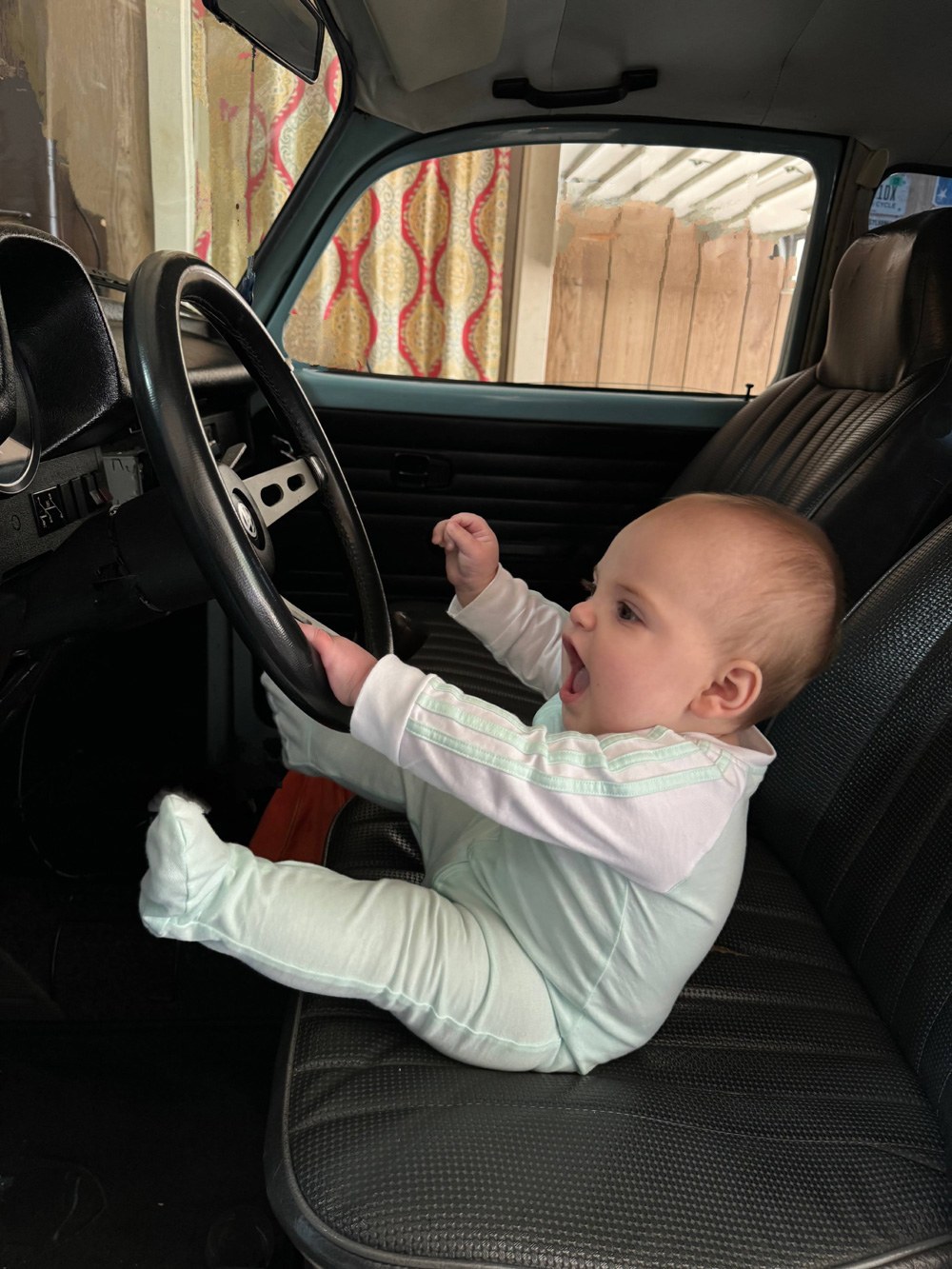 Super Beetle baby drives a VW