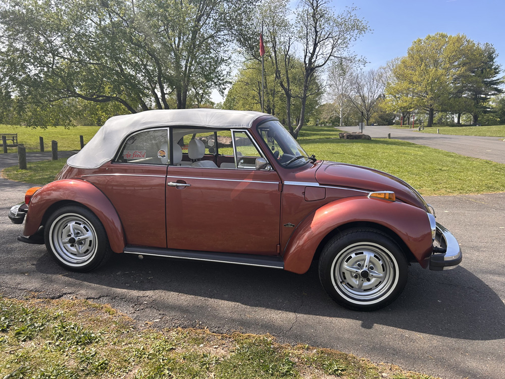 Front trunk of 1978 Champagne Edition II Super Beetle showing spare tire and fuel tank