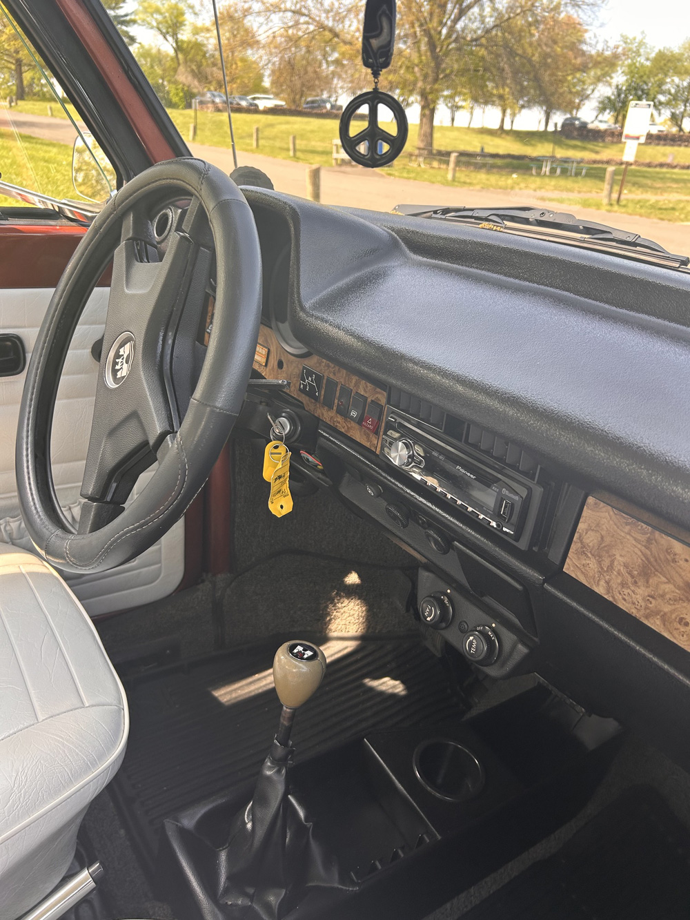 1978 Champagne Edition II Super Beetle convertible parked in a suburban neighborhood