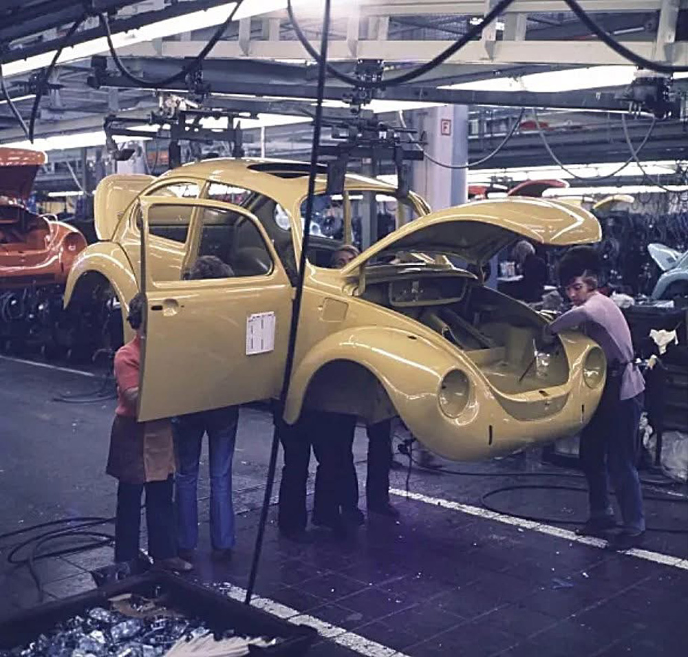 Fully painted 1973 model year VW 1303 Super Beetle bodies arrive in the fitting out hall