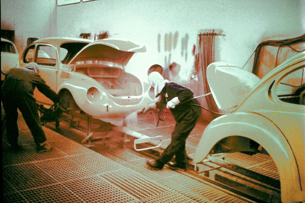 hard at work priming the Super Beetle bodies for final paint