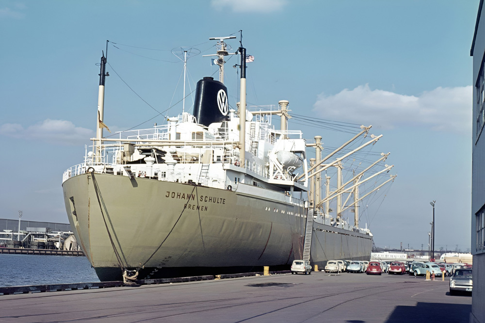 New cars on the quayside at Baltimore, Maryland, USA in December 1971 with the Bremen-registered Volkswagen transport ship Johann Schulte. With a loading capacity of 1,750 Volkswagens and a speed of 17.25 knots, she was in the 1960s the largest and fastest ship ever built for Volkswagen. 